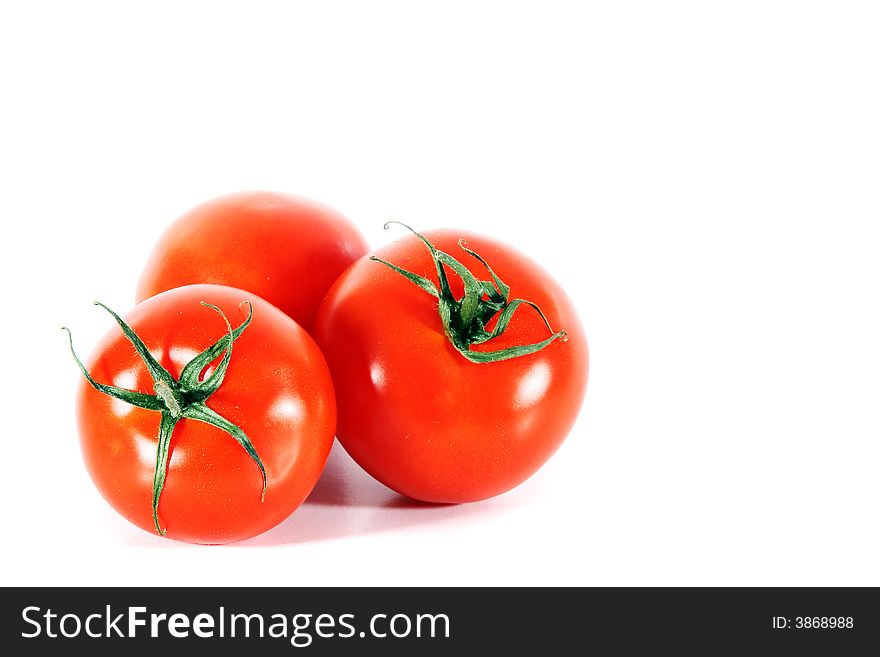 Three tomatoes - isolated over white space (for your text).