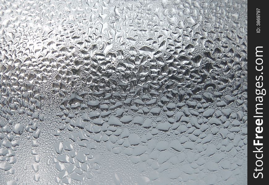 Close-up clear drops of water on window glass surface. Close-up clear drops of water on window glass surface