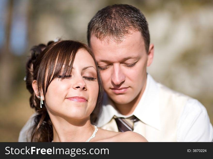 Portrait of Bridal Couple - both with closed eyes just in love. Portrait of Bridal Couple - both with closed eyes just in love