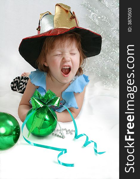 Beautiful little girl with christmas decoration green