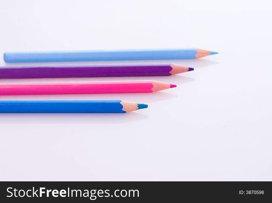 Wooden colored crayons isolated on white background