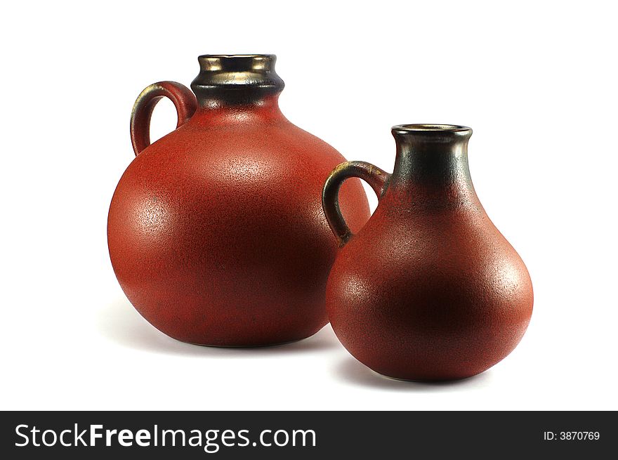 Two old jugs isolated on the white background