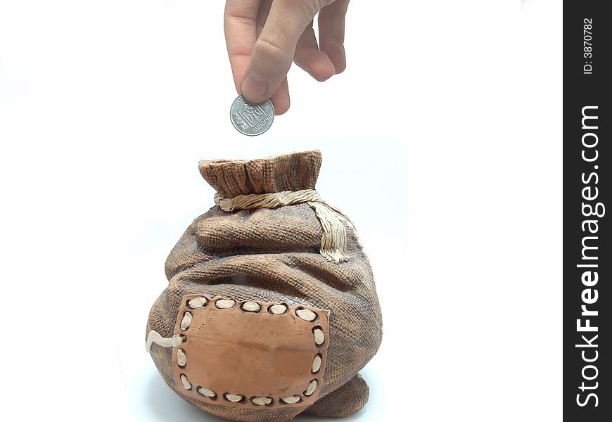 Man inserting one coin in the money bag