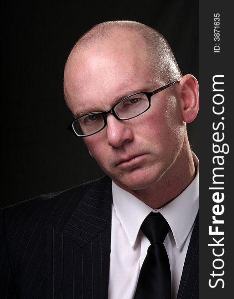 A closeup of an experienced businessman in a suit and tie. A closeup of an experienced businessman in a suit and tie