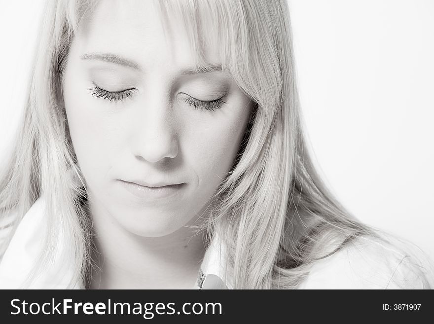 Studio portrait of a long blond girl relaxing