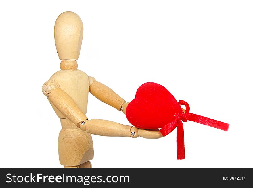 Wooden figurine man holding red fabric heart. Wooden figurine man holding red fabric heart