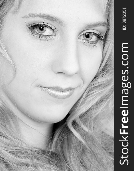 Studio portrait of a long blond girl looking mesmerised. Studio portrait of a long blond girl looking mesmerised