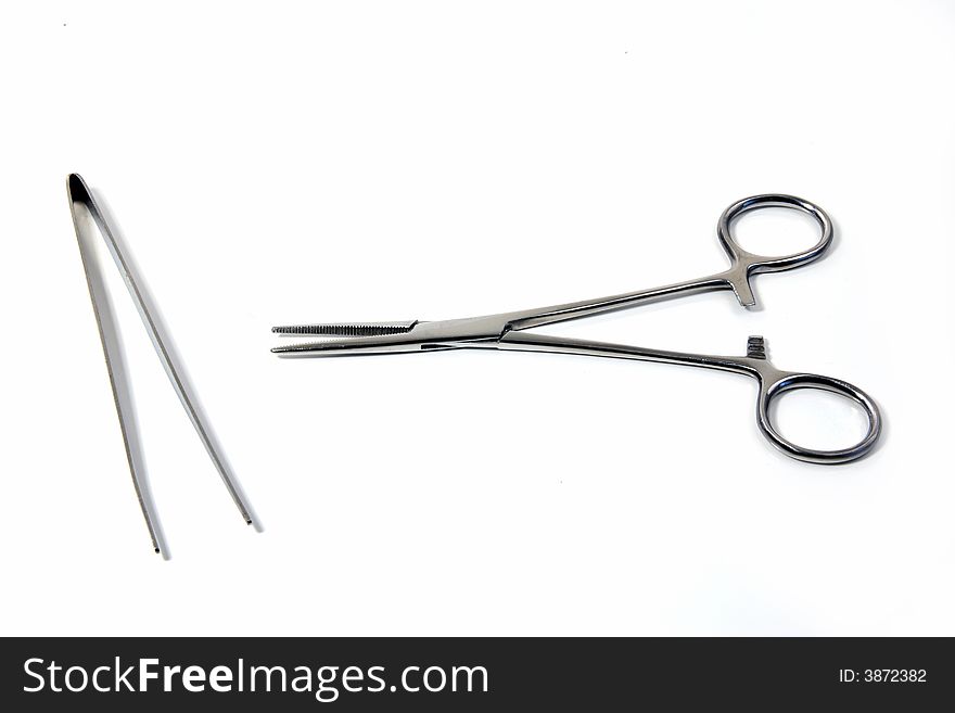 An instrument, as pincers or tongs, for seizing and holding objects, as in surgical operations. An instrument, as pincers or tongs, for seizing and holding objects, as in surgical operations.