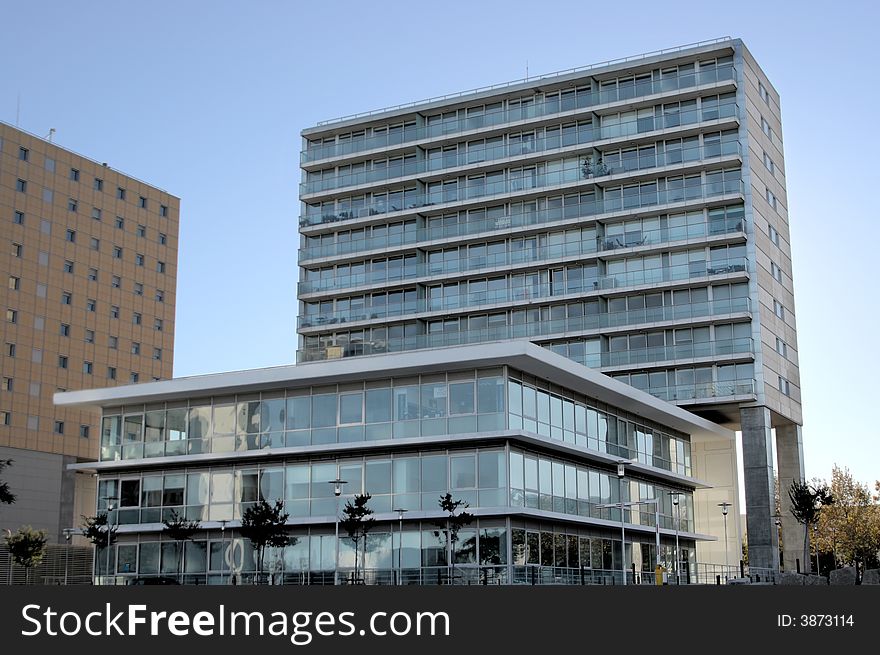 Tall office building against a bright blue sky. Tall office building against a bright blue sky