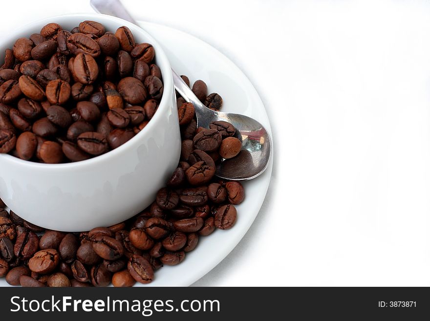 Coffee beans in coffee cup