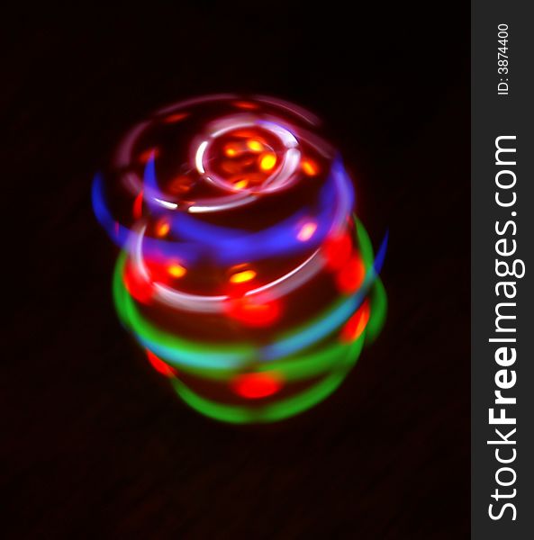 Amazing colorful light come from a rotary peg-top. Amazing colorful light come from a rotary peg-top