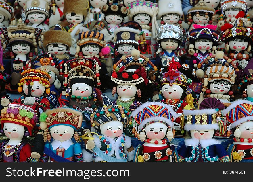 Cute Chinese doll with different minority dress