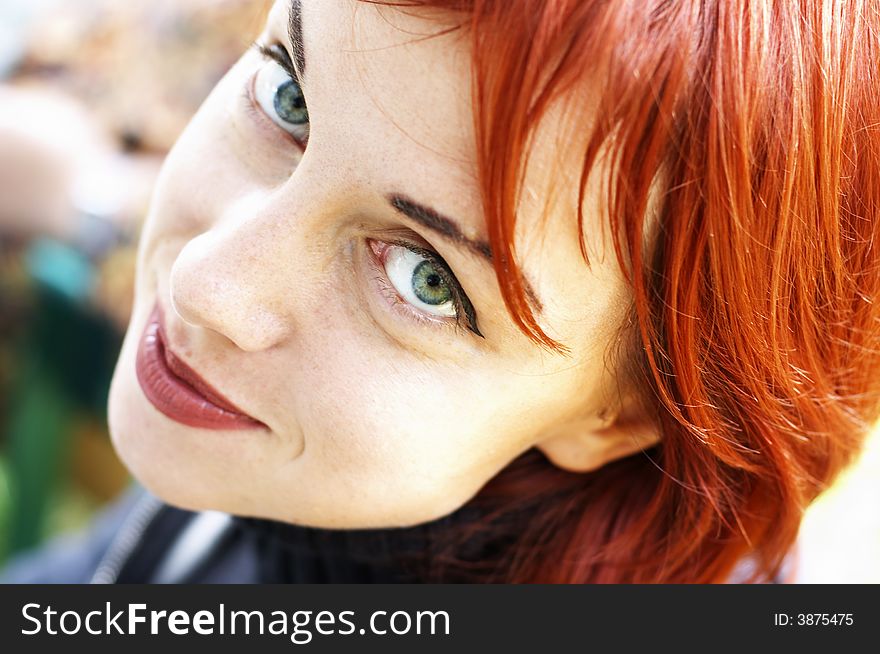 A young happy red-haired women. A young happy red-haired women