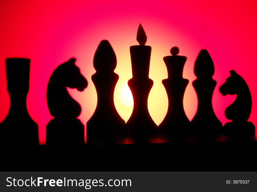 Chess on a background of a chessboard