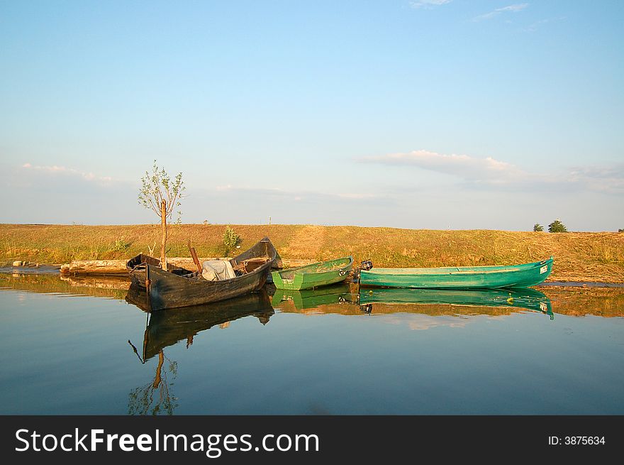 Some fisherman boats on a nice summer evening, in Danube Delta