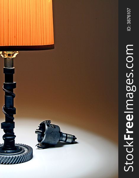 automotive table lamp made out of a camshaft with distributor on the side. automotive table lamp made out of a camshaft with distributor on the side