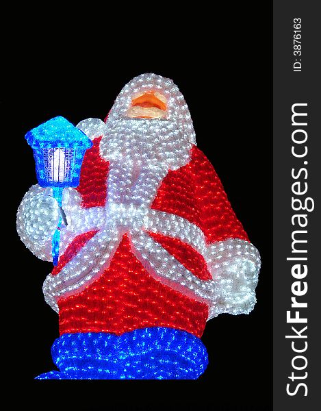 A big santa claus with light and a black background