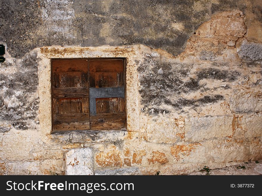 Old window on old destroyed house. Old window on old destroyed house