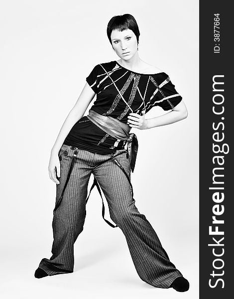 Studio portrait of a young woman with short hair looking fashionable. Studio portrait of a young woman with short hair looking fashionable