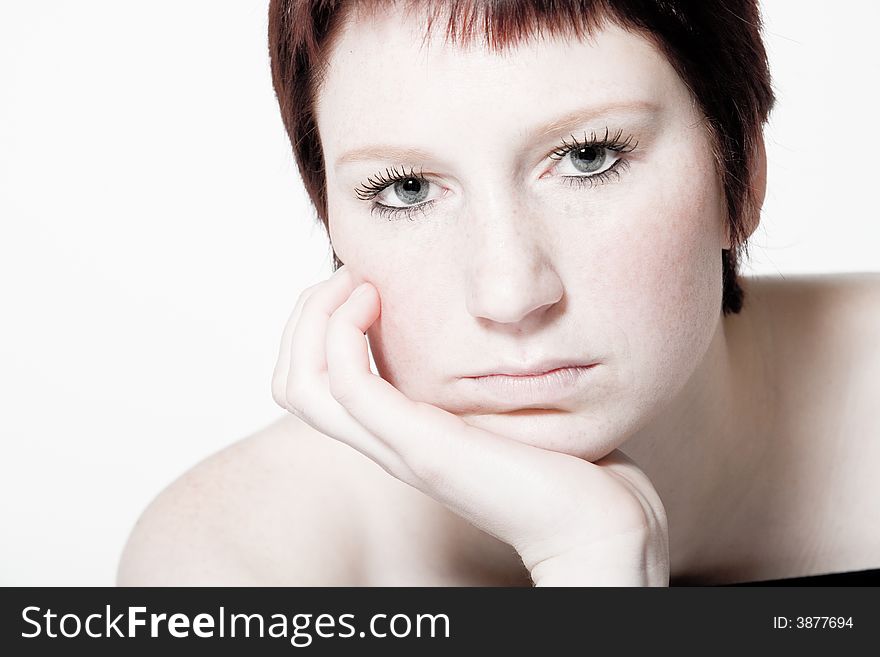 Studio portrait of a bored young woman with short