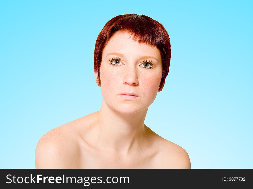 Studio portrait of a young woman with short hair looking neutral. Studio portrait of a young woman with short hair looking neutral