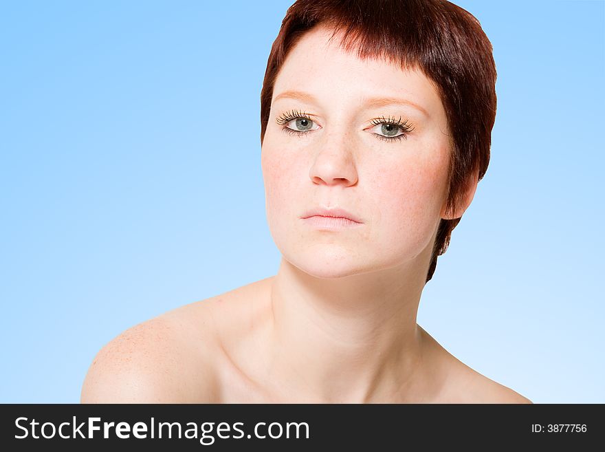 Studio portrait of a young woman with short hair looking uptight. Studio portrait of a young woman with short hair looking uptight