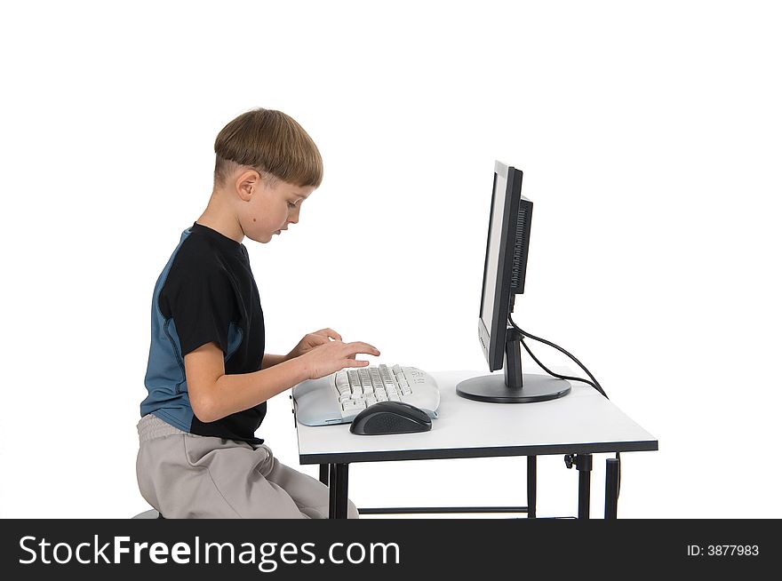 Boy on computer with cordless mouse and keyboard. Boy on computer with cordless mouse and keyboard.