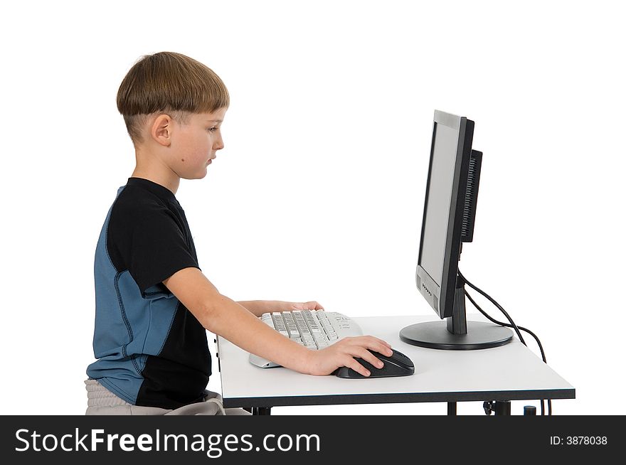 Boy on computer with cordless mouse and keyboard. Boy on computer with cordless mouse and keyboard.