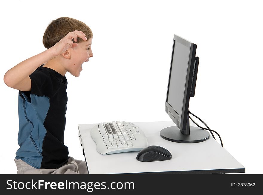 Boy on computer with cordless mouse and keyboard. Boy on computer with cordless mouse and keyboard.