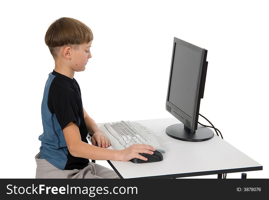 Boy on computer with cordless mouse and keyboard. Boy on computer with cordless mouse and keyboard.