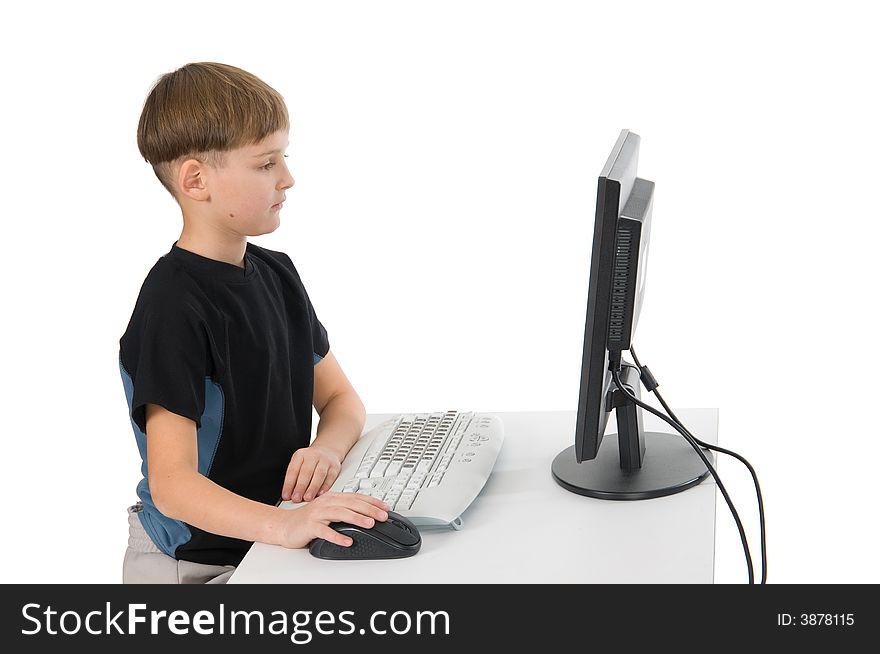 Boy on computer with cordless mouse and keyboard. Boy on computer with cordless mouse and keyboard.