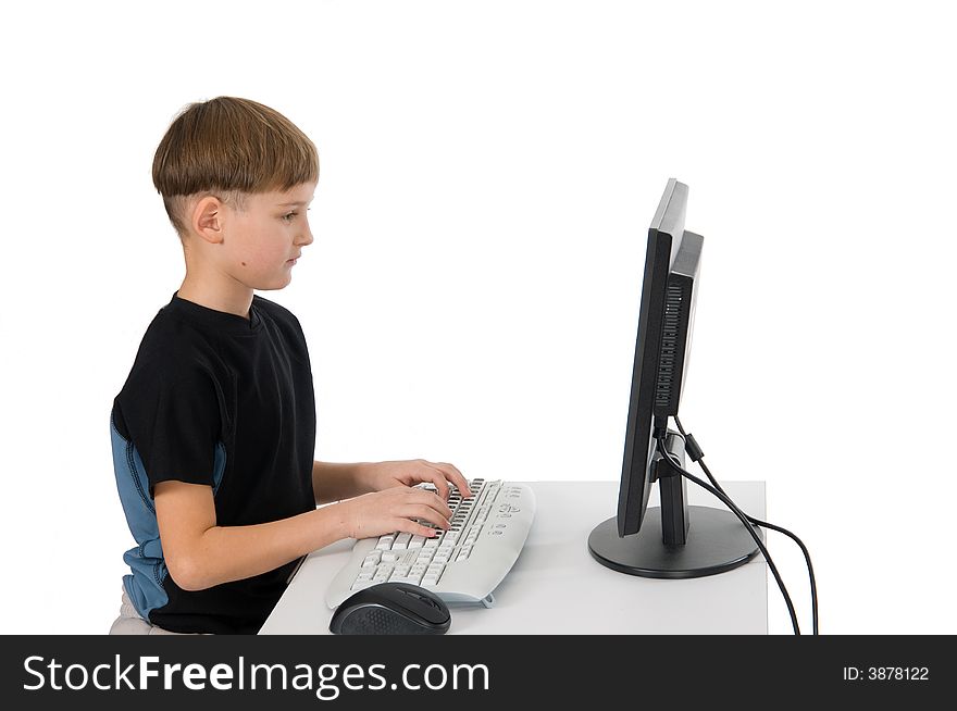 Boy on computer with cordless mouse and keyboard. Boy on computer with cordless mouse and keyboard.