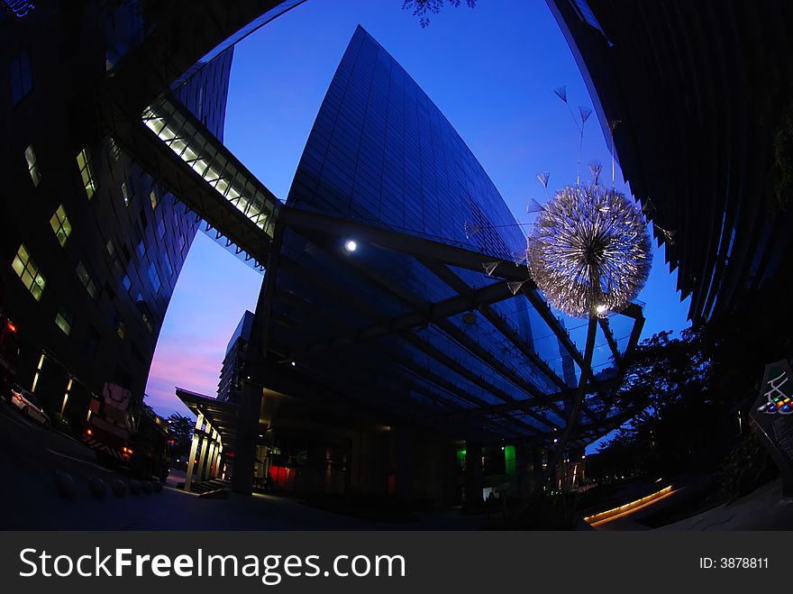 Iron flower and modern building in the city