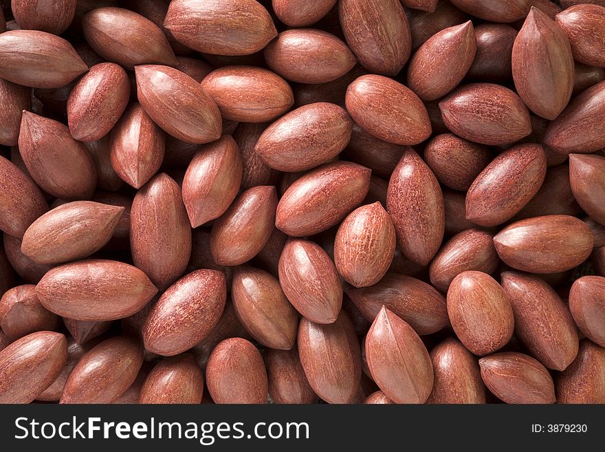 Textured background of pecans in shells