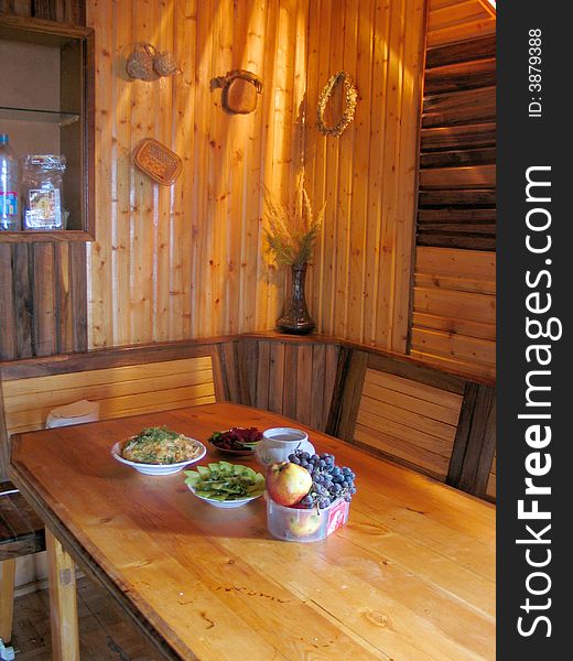 Plates with fruits on yellow table. Plates with fruits on yellow table