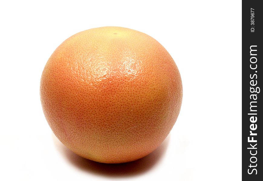 One orange grapefruit with its shadow on white background. One orange grapefruit with its shadow on white background