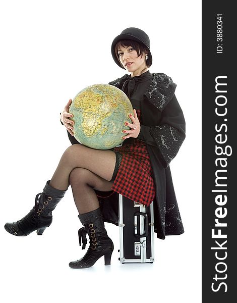 Beautiful brunette with valise and globe on isolated background