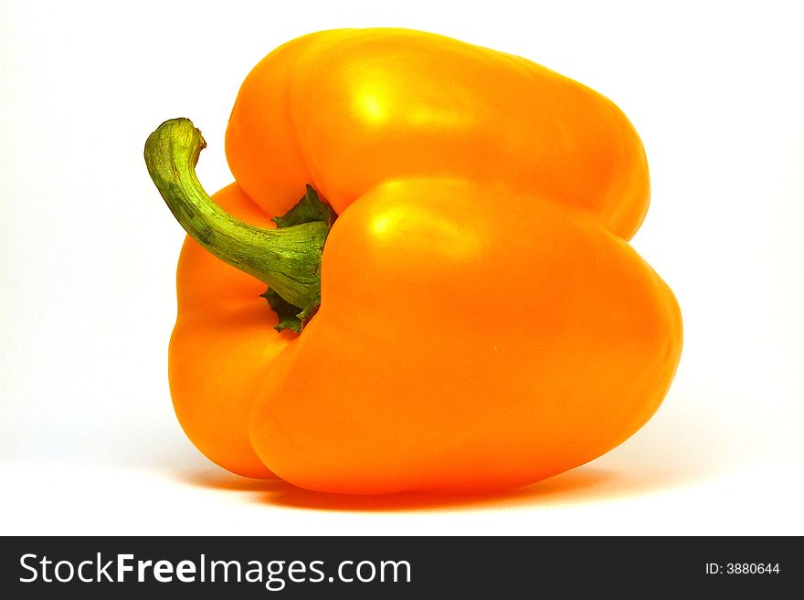 Fruit of yellow paprika against a white background