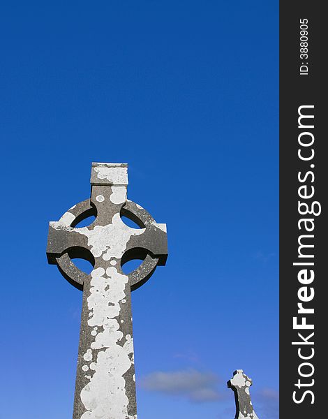 A celtic cross in an irish graveyard. A celtic cross in an irish graveyard