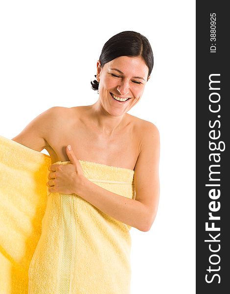Nice woman wrapping into big bath towel while laughing. Nice woman wrapping into big bath towel while laughing