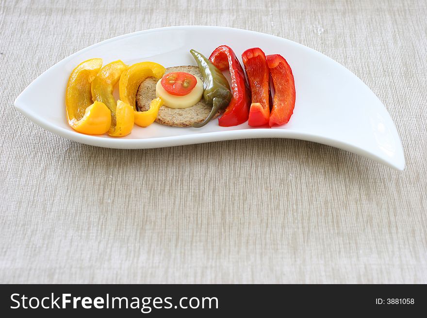 Healthy colorful platter with assorted vegetables on fancy white china. Healthy colorful platter with assorted vegetables on fancy white china