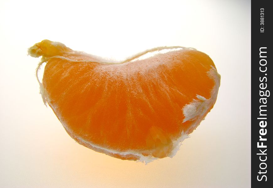 Slice of orange color of  fruit of  tangerine, close up. Slice of orange color of  fruit of  tangerine, close up