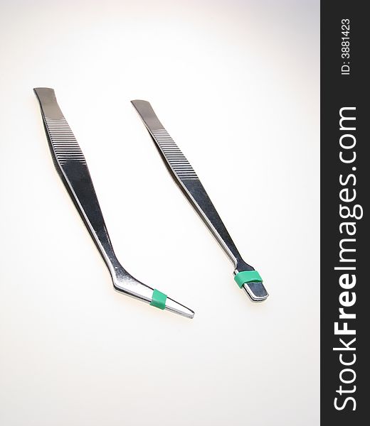 Two technical tweezers isolated on  white background