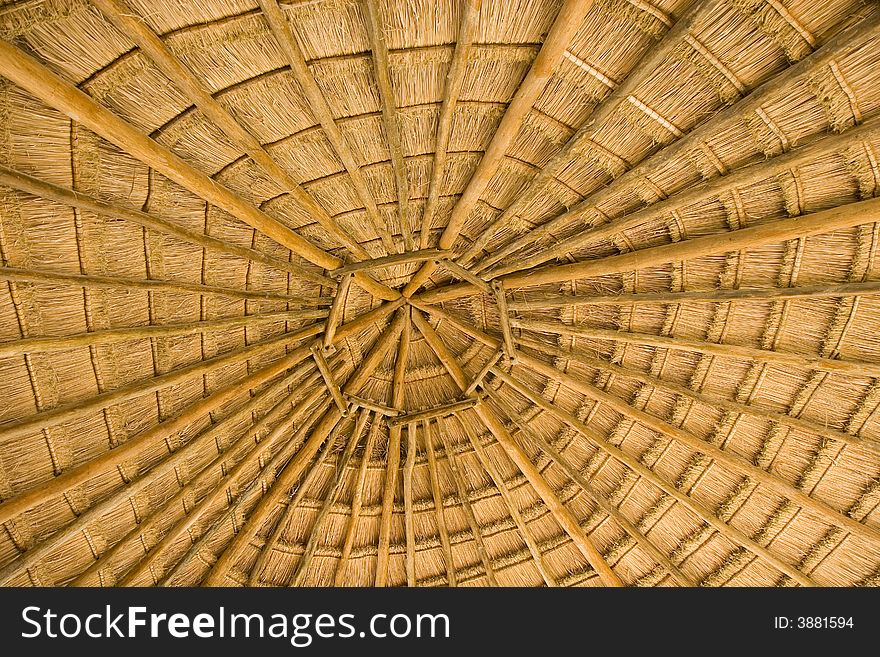 A straw roof on a structure showing concentric circles