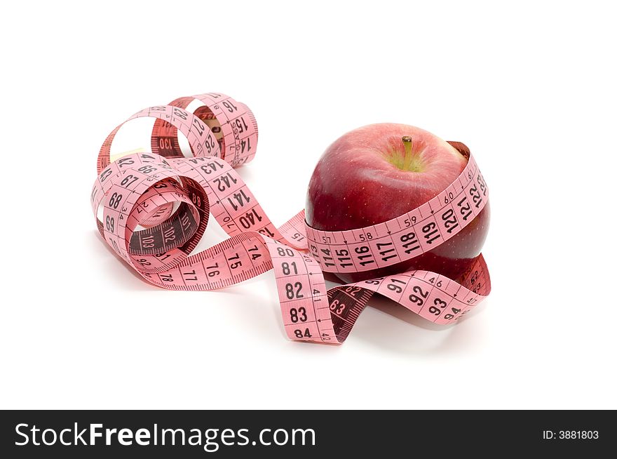 Apple and measuring tape isolated on a white