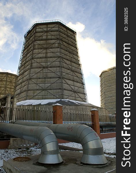 Electric power station chimneys over blue sky