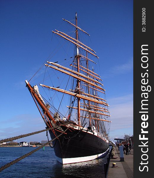 Large sailing ship docked in a port. Large sailing ship docked in a port