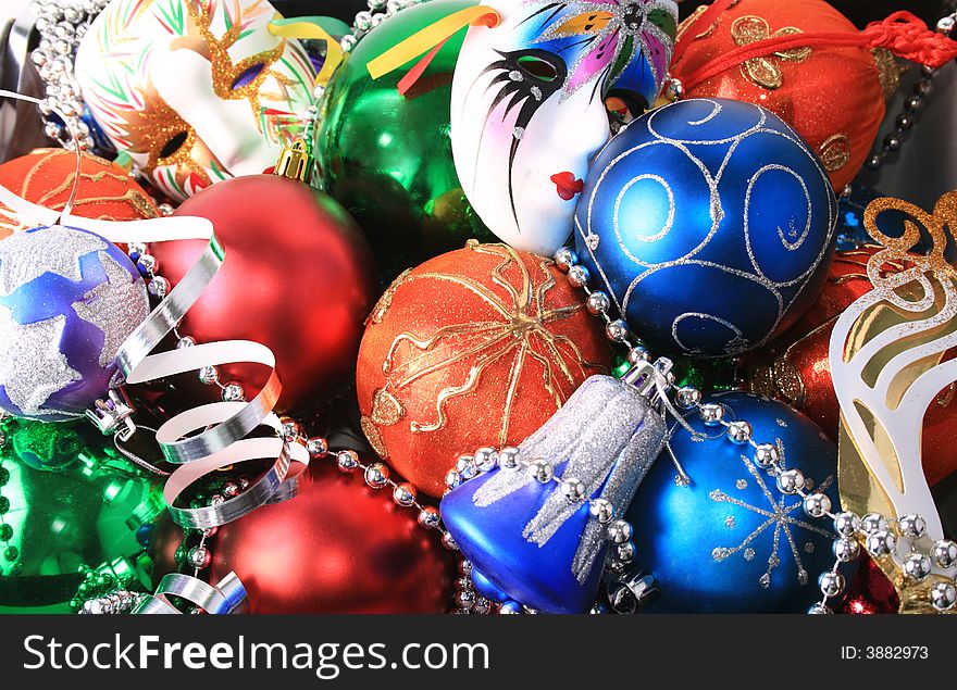 Colorful christmas bulbs, mask, beads and streamer