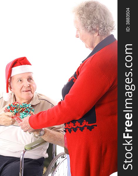 Elderly Man In Wheelchair Giving Wife A Present