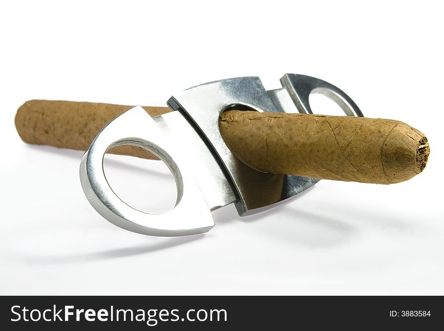 Cigars and accessories on white background